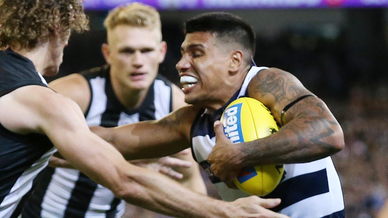 AFL Round 1. 22/03/2019. Collingwood vs Geelong at the MCG.  Tim Kelly of the Cats pushes away Chris Mayne of the Magpies  4th qtr  . Pic: Michael Klein.