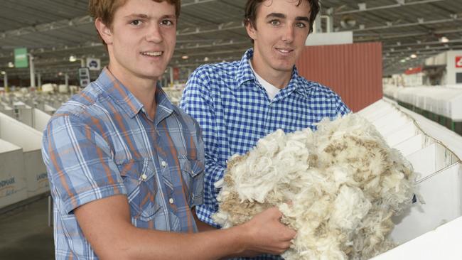 Superfine price: Alex Lewis and Lachlan Barty with wool from Beverley Merino stud at Redesdale last week. Picture: Greg Scullin