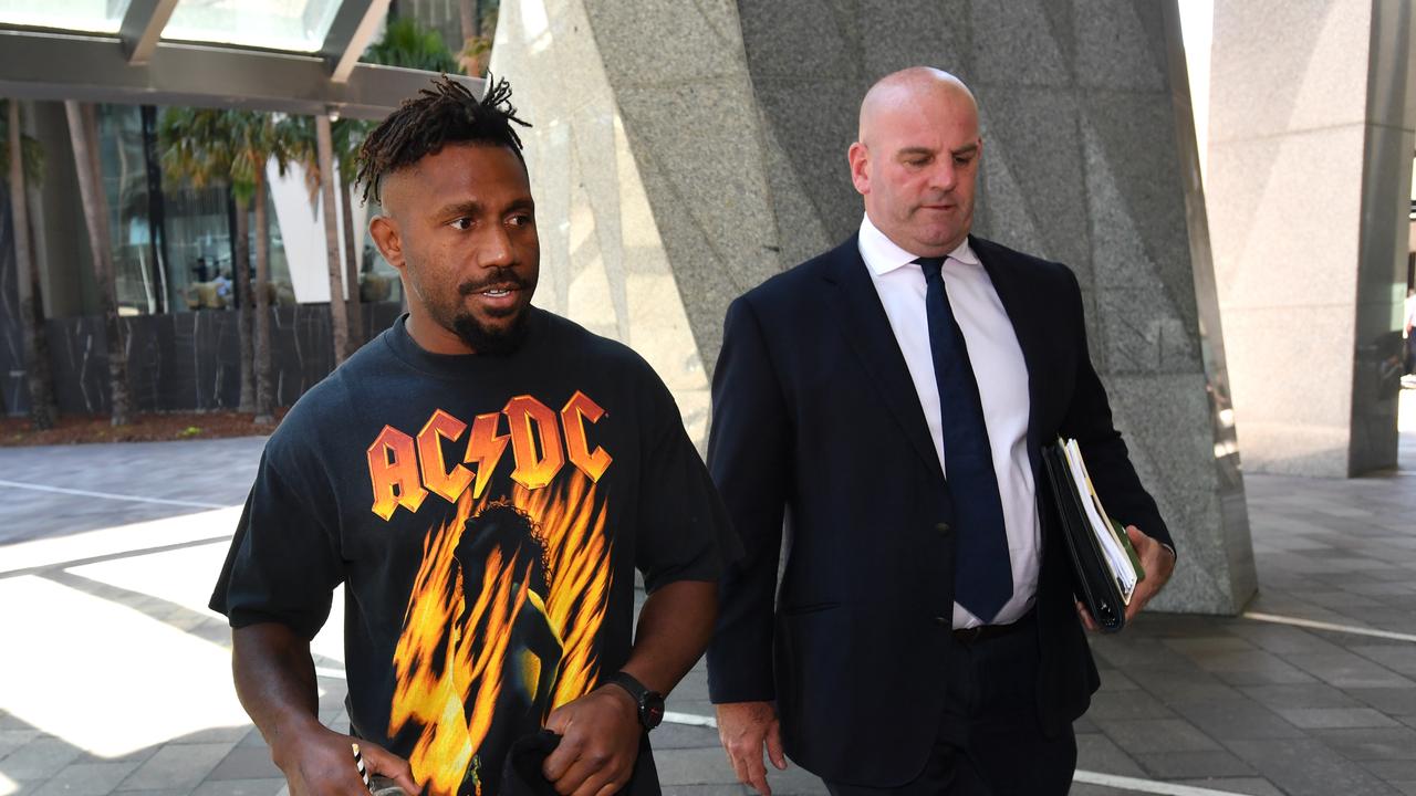 Jack’s lawyer Tim Fuller (right), seen here with former Brisbane Broncos player James Segeyaro. (AAP Image/Darren England) NO ARCHIVING