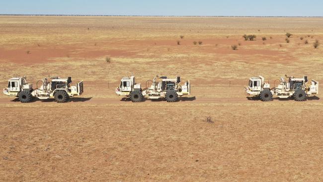 Seismic trucks conduct a geophysical survey in Queensland’s North West Minerals Province.