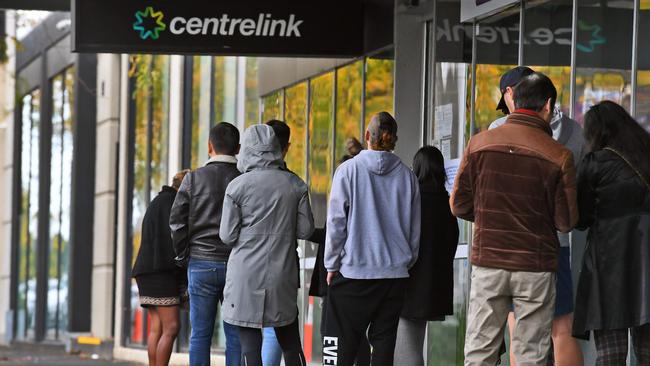 People queue up outside a Centrelink office in Melbourne. Picture: AFP