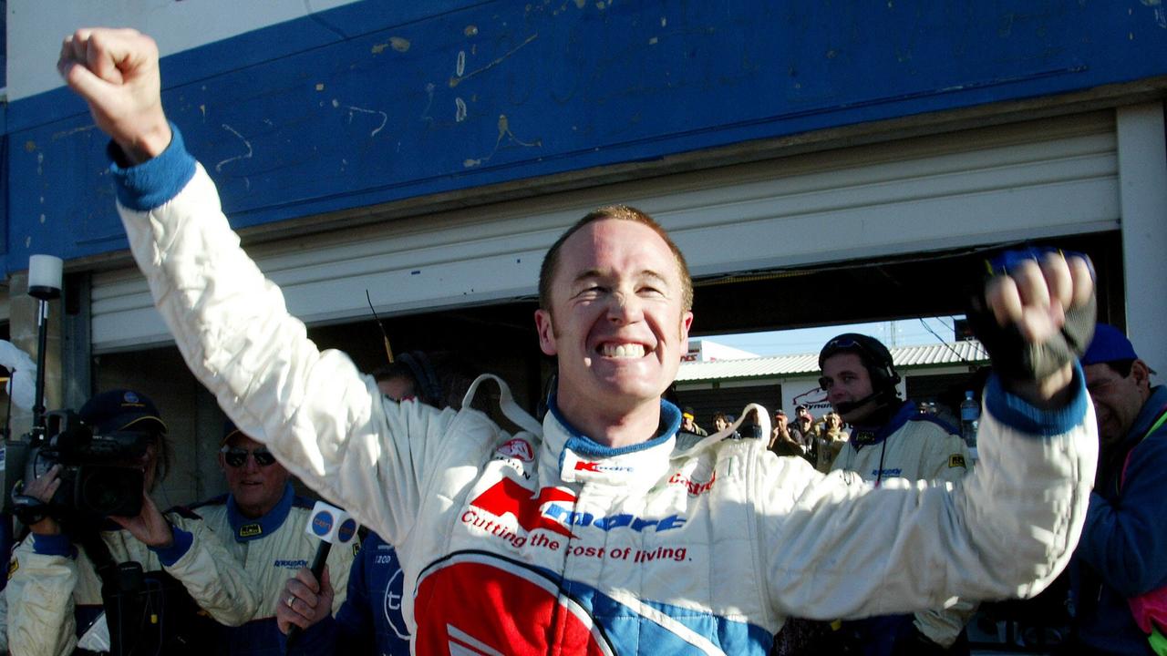 OCTOBER 11, 2003: Kmart Holden Commodore driver Greg Murphy celebrates after taking pole position in top 10 shootout for 2003 Bathurst 1000 V8 Supercar race at Mount Panorama, 11/10/03. Pic Cameron Tandy. Motor Racing P/