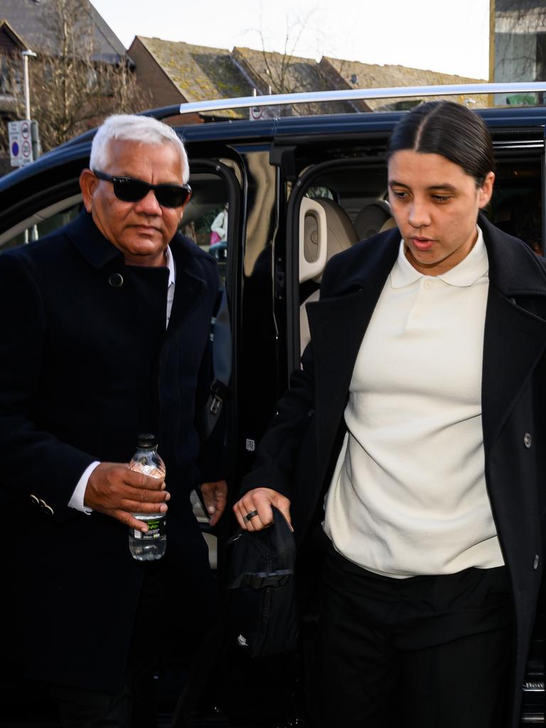 Sam Kerr arrives at court with her father Roger Kerr. (Photo by Leon Neal/Getty Images)