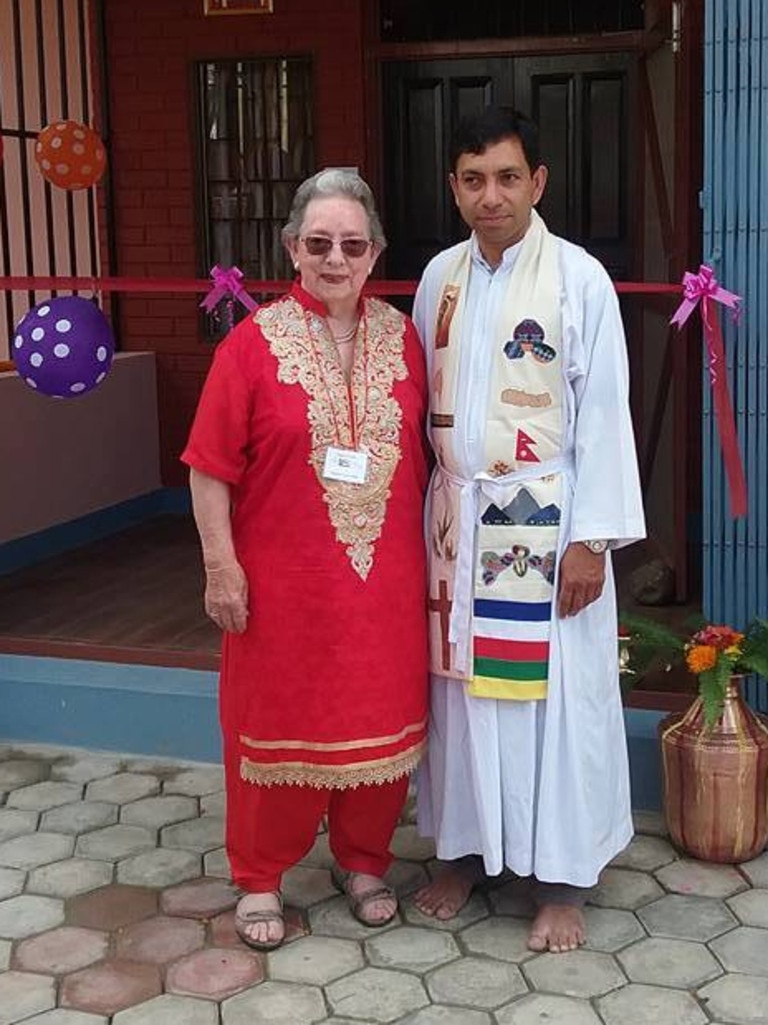 Joan Correll and Anglican Father Thomas Karamakuzhiyil. Pictures: supplied