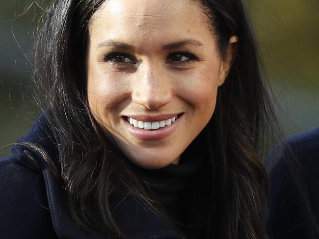 FILE - In this Dec. 1, 2017 file photo, Britain's Prince Harry and his fiancee Meghan Markle arrive at Nottingham Academy in Nottingham, England.  For some black women, Meghan Markle and Prince Harryâ€™s engagement was something more. One of the worldâ€™s most eligible bachelors had chosen someone who looked like them and grew up like them. (AP Photo/Frank Augstein, File)