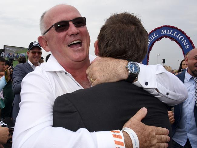 Winner of race 4 Madam Rouge owner Noel Greenhalgh celebrates at the Magic Millions race day at the Gold Coast Turf Club. (Photo/Steve Holland)