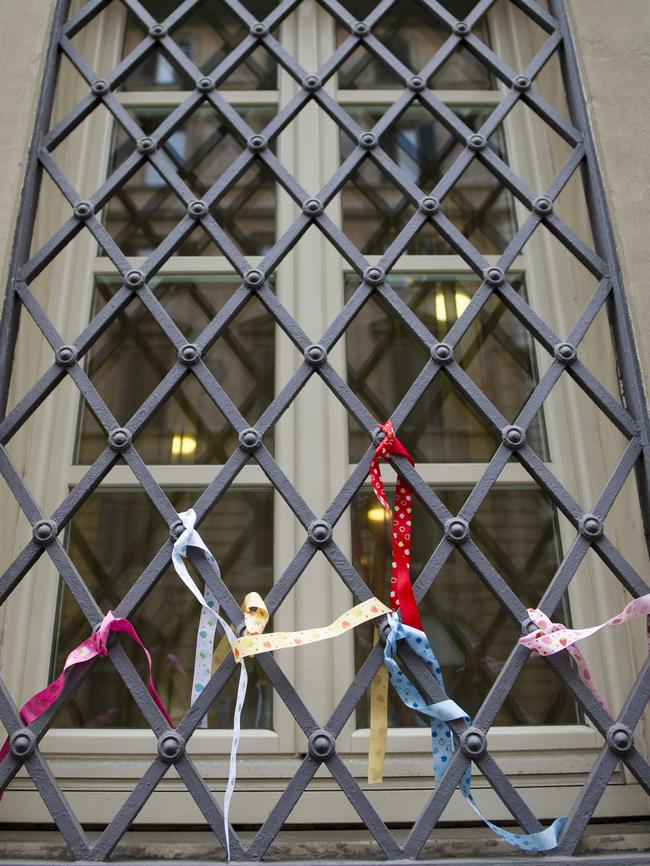 Ribbons placed on window grates at Domus Australia. Picture: David Mirzoeff