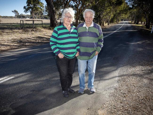 ADELAIDE, SOUTH AUSTRALIA - Advertiser Photos May 22, 2025 - Jill and Ian Williams view the uneven road outside their property on Inman Valley Rd, Inman Valley (near Hancock Rd intersection) Picture: Emma Brasier