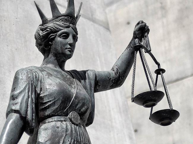 A statue of Themis, the Greek God of Justice  stands outside the Supreme Court in Brisbane, Thursday, Oct. 20, 2016. (AAP Image/Dave Hunt) NO ARCHIVING