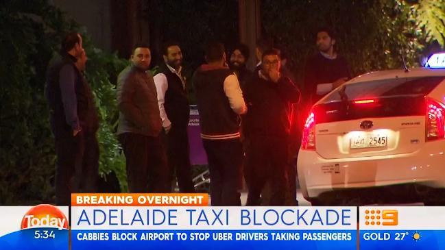 Taxi drivers block Adelaide airport in stand against Uber