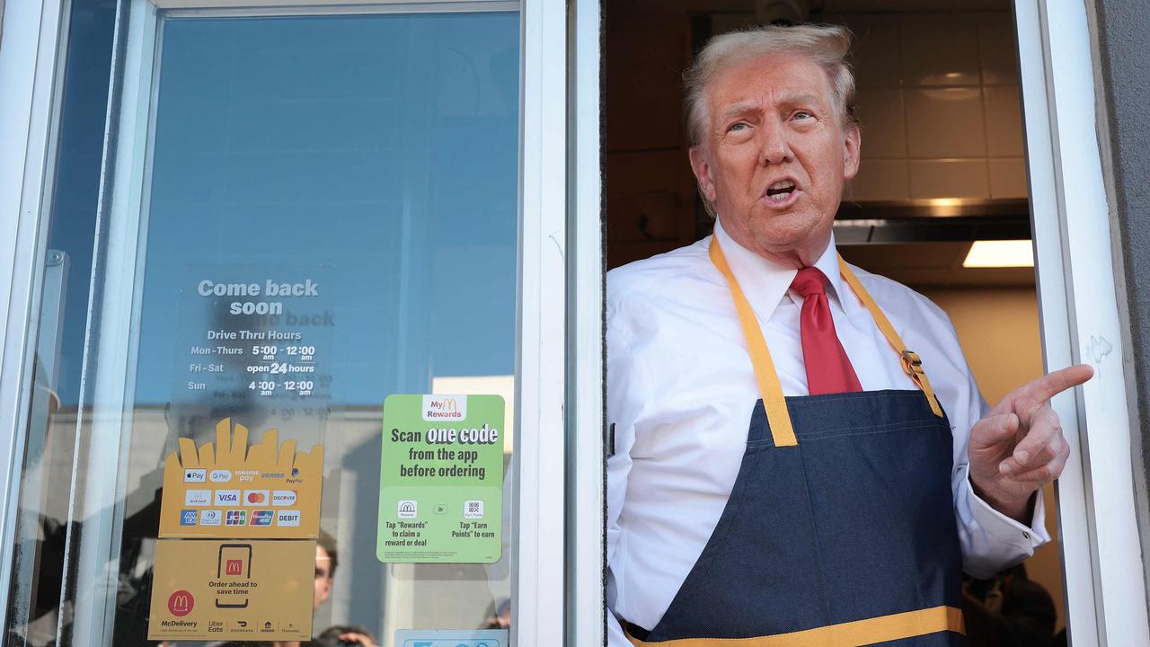 Republican presidential nominee and former US President Donald Trump works a staged drive-through line at a McDonald's restaurant in Feasterville-Trevose, Pennsylvania. Picture: Win McNamee/Getty Images/AFP