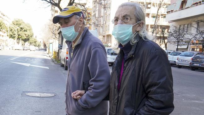 Elderly people stroll in Rome amid the coronavirus pandemic. Picture: AP/Andrew Medichini