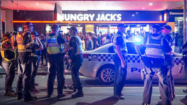 A heavy police presence gathers in Swanston St following brawls during this year’s Moomba festivities. Picture: Jake Nowakowski