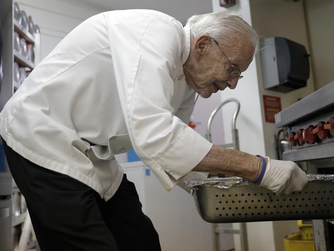 On a mission ... Mr Abbot, director of the non-profit group Love Thy Neighbor, makes hundreds of meals every week for the homeless in Fort Lauderdale’s Sanctuary Church. Picture: Lynne Sladky/AP