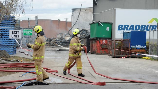 Firefighters at the scene of yesterday’s fire. Picture: Andrew Henshaw