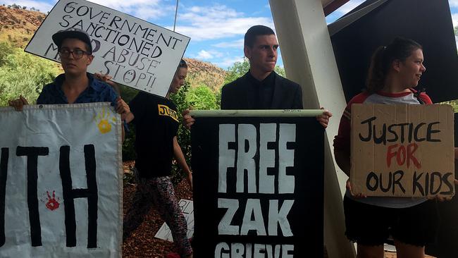 Dylan Voller (centre) with supporters during a rally outside the Northern Territory juvenile justice royal commission in Alice Springs. PICTURE: Lucy Hughes Jones