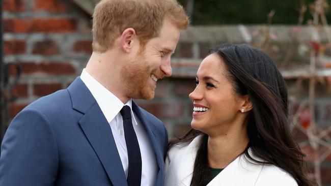 LONDON, ENGLAND - NOVEMBER 27:  Prince Harry and Meghan Markle during an official photocall to announce the engagement of Prince Harry and actress Meghan Markle at The Sunken Gardens at Kensington Palace on November 27, 2017 in London, England.  Prince Harry and Meghan Markle have been a couple officially since November 2016 and are due to marry in Spring 2018.  (Photo by Chris Jackson/Getty Images)