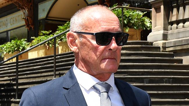 Chris Dawson leaves the Downing Centre Local Court in Sydney.