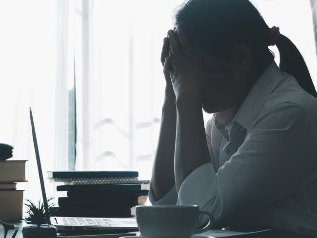 Stress business woman person from hard work, depression in office. Tired and anxious employee female with unhappy at problem job. young businesswoman sitting sad front of laptop computer on desk.