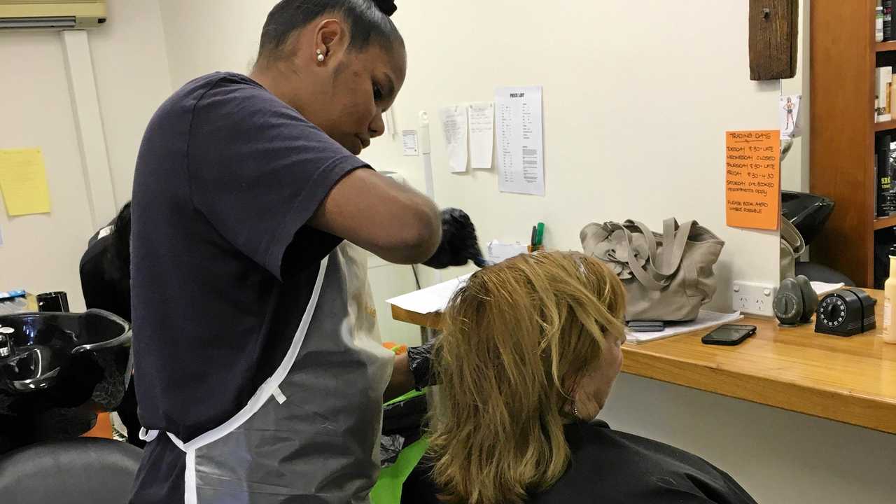 Year 10 student Nikitah Speedy with a client at Original Hair by Gina. Picture: Murgon State High School