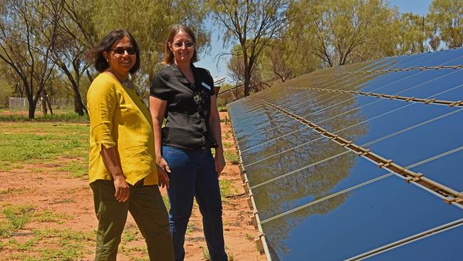 Dr Deepika Mathur and Robin Gregory at the solar panel array at the Desert Knowledge Australia precinct in Alice Springs.