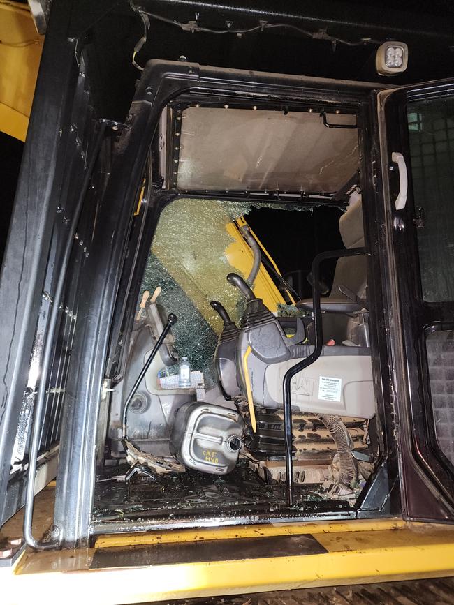 A window was smashed on the excavator and an open 20-litre container of hydraulic fluid thrown into the cab.