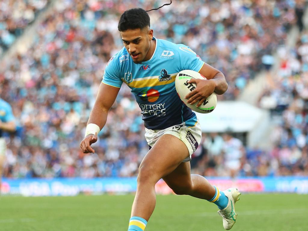 GOLD COAST, AUSTRALIA - JUNE 22: Alofiana Khan-Pereira of the Titans scores a try during the round 16 NRL match between Gold Coast Titans and New Zealand Warriors at Cbus Super Stadium, on June 22, 2024, in Gold Coast, Australia. (Photo by Chris Hyde/Getty Images)