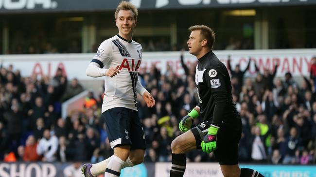 Tottenham’s Christian Eriksen (L) celebrates after scoring a goal.