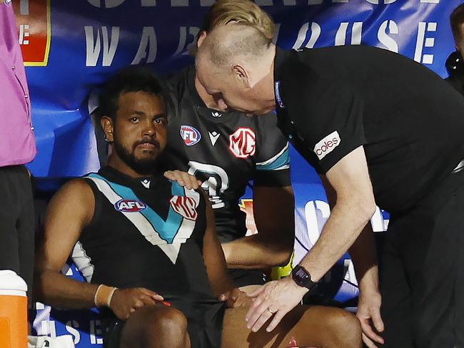 NCA. MELBOURNE, AUSTRALIA. 13th April, 2025 . Gather Round.  Port Adelaide vs Hawthorn at the Adelaide Oval.  Ken Hinkley, head coach of the Power talks with Willie Rioli on the bench late in the match   . Picture: Michael Klein