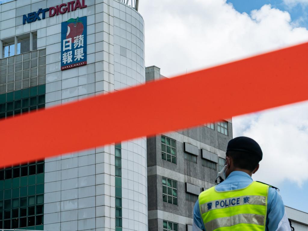 Police tape is seen outside the headquarters of the Apple Daily newspaper and its publisher Next Digital.