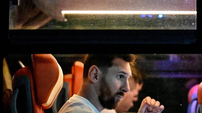 Lionel Messi along with his teammates leaves the Olympic Stadium after a training session in Beijing.