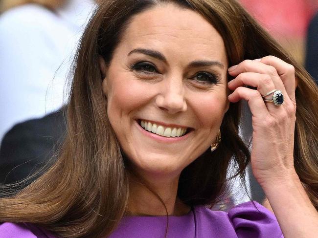 TOPSHOT - Britain's Catherine, Princess of Wales reacts as she arrives in the Royal Box on Centre Court to attend the men's singles final tennis match on the fourteenth day of the 2024 Wimbledon Championships at The All England Lawn Tennis and Croquet Club in Wimbledon, southwest London, on July 14, 2024. (Photo by ANDREJ ISAKOVIC / AFP) / RESTRICTED TO EDITORIAL USE