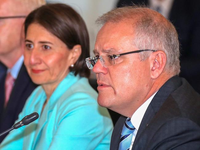 The Premier of New South Wales Gladys Berejiklian (2nd R) listens as Australian Prime Minister Scott Morrison (R) speaks during the Meeting of the Council of Australian Governments (COAG) at Parramatta Stadium in western Sydney on March 13, 2020. (Photo by DAVID GRAY / POOL / AFP)