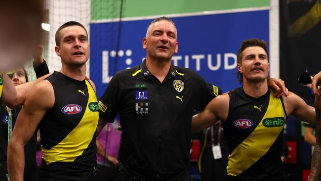 MELBOURNE, AUSTRALIA - MARCH 31:  Jayden Short, Adem Yze and Liam Baker of the Tigers sing the song in the rooms after winning the round three AFL match between Richmond Tigers and Sydney Swans at Melbourne Cricket Ground, on March 31, 2024, in Melbourne, Australia. (Photo by Quinn Rooney/Getty Images)