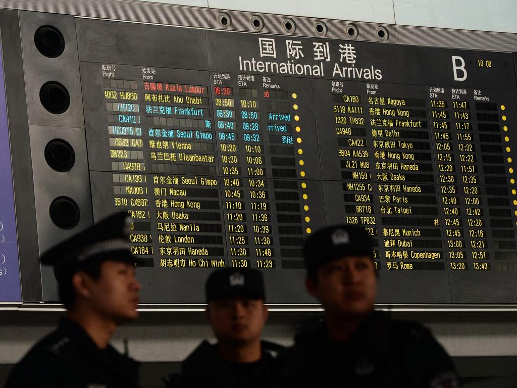 Police on the day Malaysia Airlines flight 370 vanished. Picture: Mark Ralston/AFP