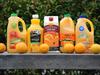 Various Australian orange juice brands - (l-r) bottles of Golden Circle, Crusta, Berri, Nippy's and Daily Juice.