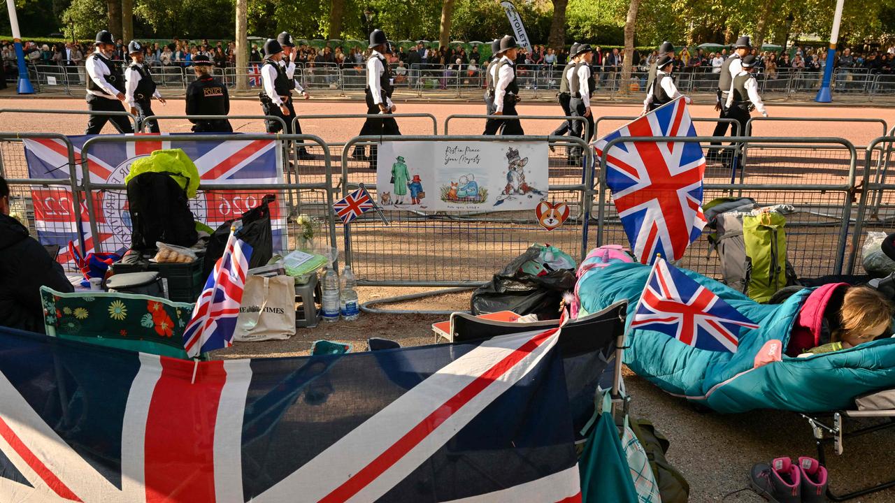 The Mall, UK: Members of the public camp out as Police officers patrol at The Mall near Buckingham Palace on September 18, 2022, ahead of Queen Elizabeth II's funeral on September 19. Picture: AFP