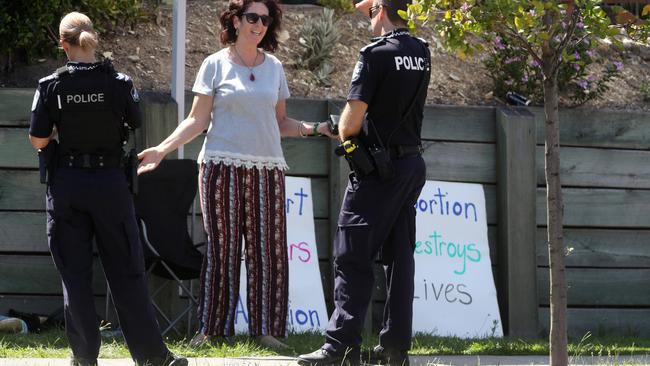 Police speaking with Anne Rampa outside Brisbane Day Hospital, December last year. Picture: Tara Croser.