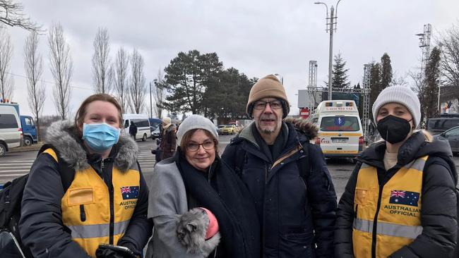 Rachel Lehmann-Ware and husband Duncan Ware with two DFAT staff members who met them at the Romanian border. Picture Supplied,