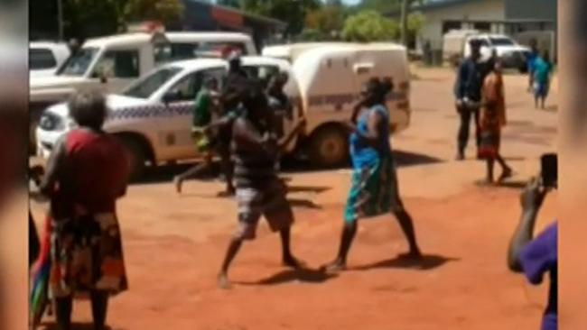 Police watch on as women brawl