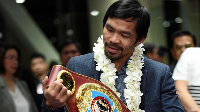 Manny Pacquiao with his WBO welterweight title belt late last year. Photo: AFP