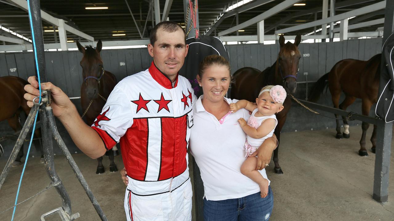 Harness racing Driver Pete McMullen and his partner Chantal Turpin with daughter Riley (9 1/2 mths) at Albion Park.