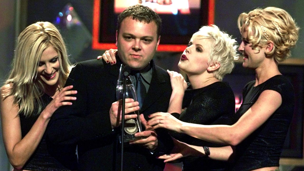 The Chicks: Martie Maguire, Natalie Maines and Emily Strayer with video director Thom Oliphant at the Country Music Association Awards in 1999. Picture: Supplied