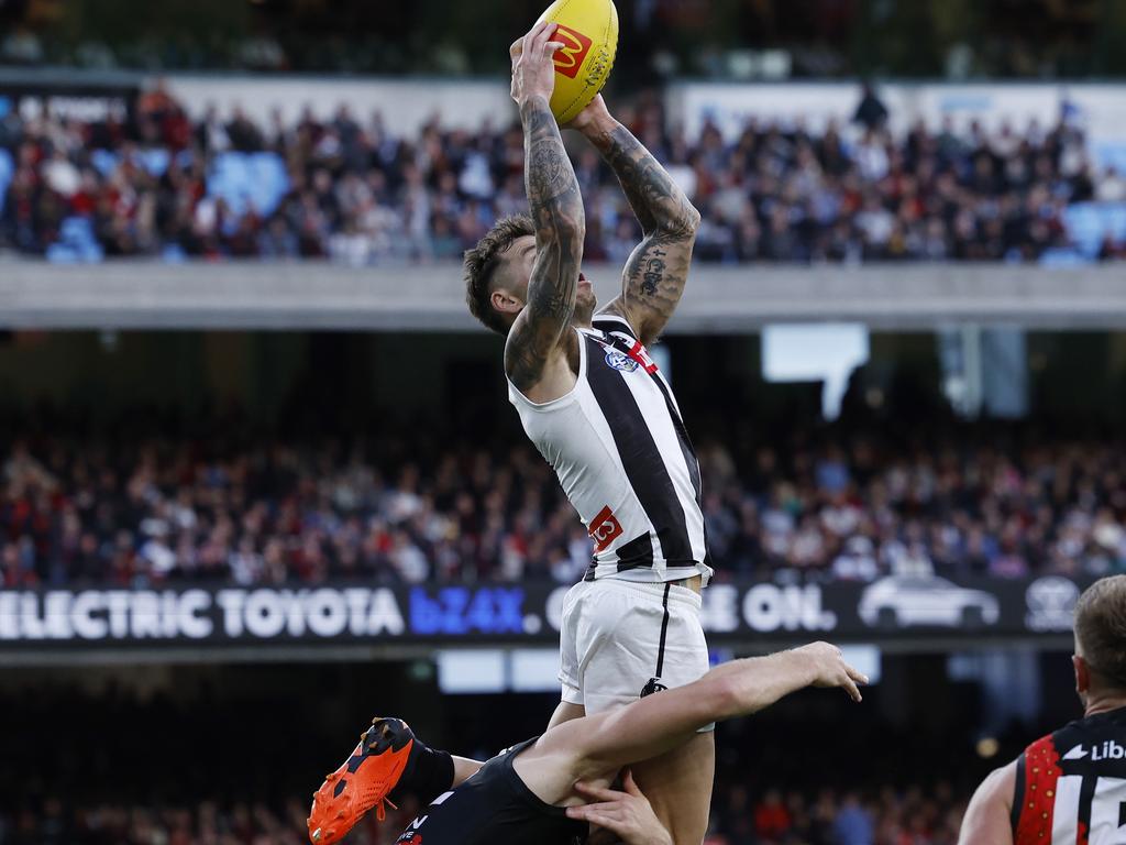 Jamie Elliott marks over Ben McKay in an instant Anzac Day classic. Picture: Michael Klein