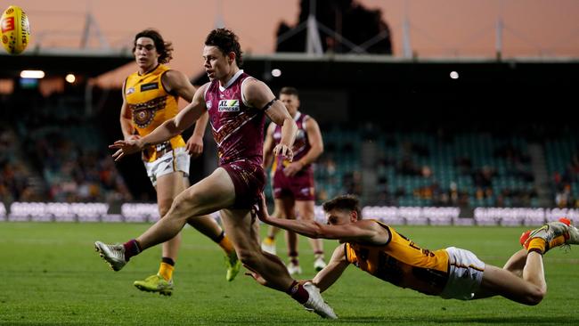 Will Day tries to chase down Lachie Neale. Picture: Dylan Burns/AFL Photos via Getty Images