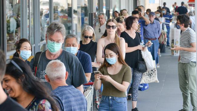 People queue at a supermarket following the announcement of the lockdown on Wednesday. Picture: Brenton Edwards / AFP