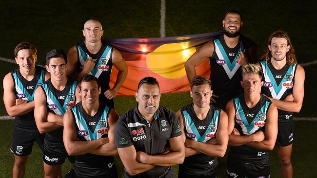 Port Adelaide's indigenous players: Back: Sam Powell-Pepper and Paddy Ryder: Front: Tobin Cox, Joel Garner, Steven Motlop, Karl Amon, Aidyn Johnson, Jarrod Lienert with Aboriginal programs manager Paul Vandenbergh, centre. Picture: Naomi Jellicoe.