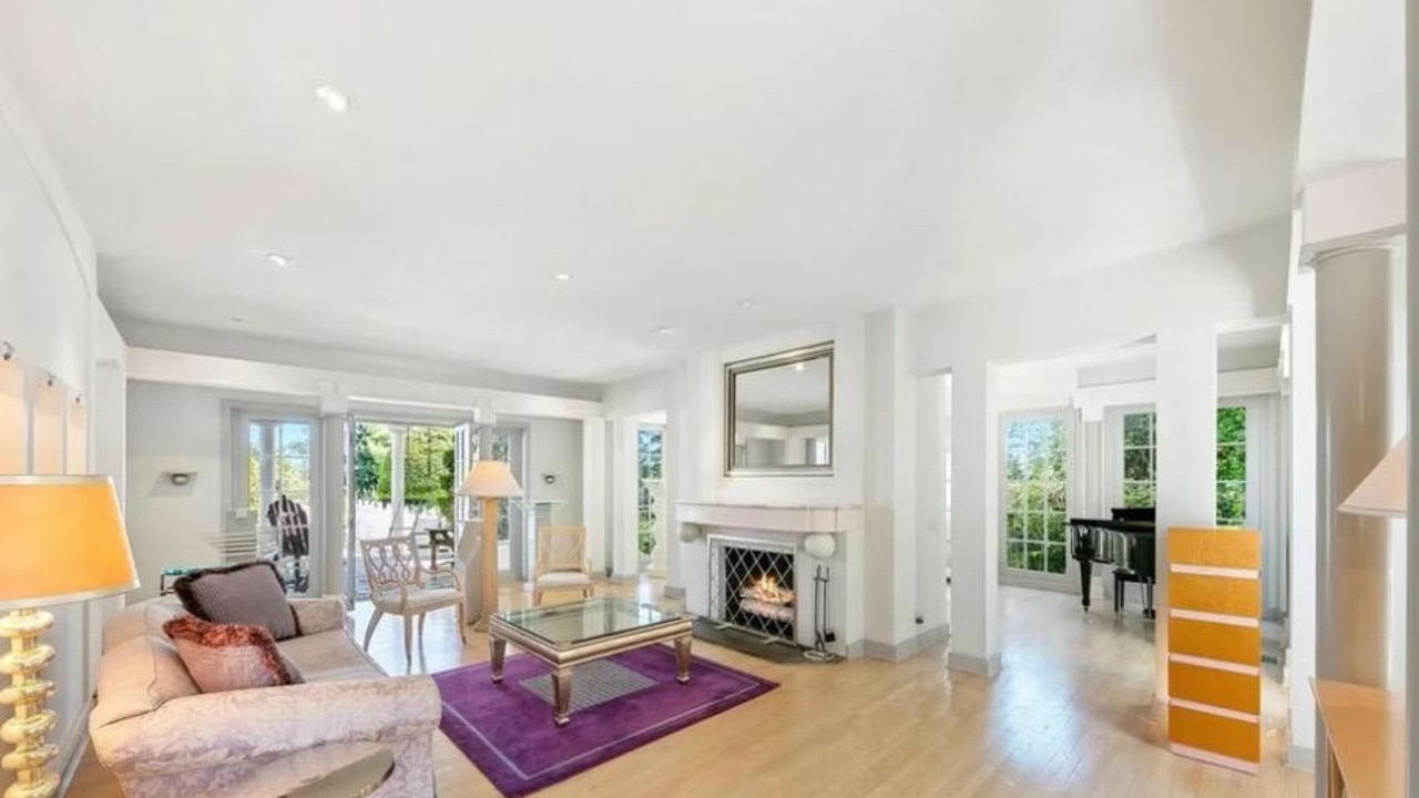 Although the personal items have been removed from the home, there is still plenty of furniture inside it. Picture: Realtor