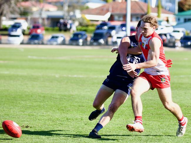 Clarence’s Darcy Gardner races for the ball ahead of Launceston’s Casey Brown. Picture: Andrew Woodgate