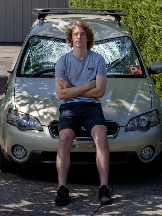 Zac Thiessen with his damaged car.